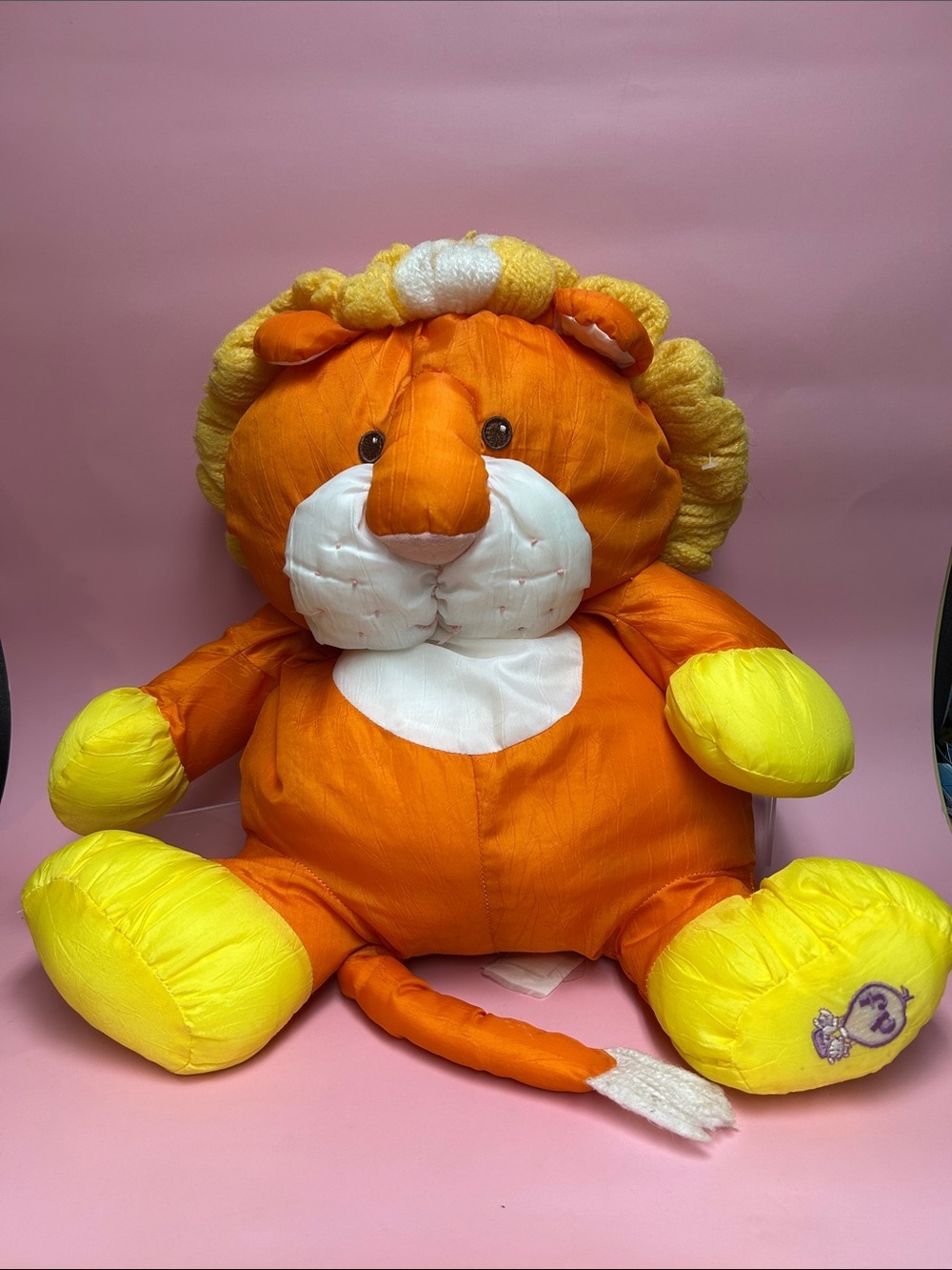 Flame-orange Puffalumps lion, vintage 1980s, from Fisher-Price.